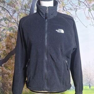 The North Face SP black zip up furry jacket